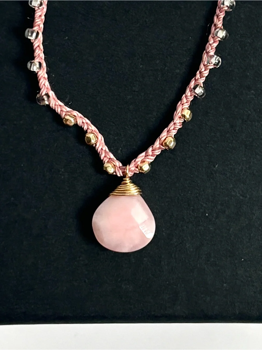 Pink silk thread necklace with a beautiful pink coral briolette stone